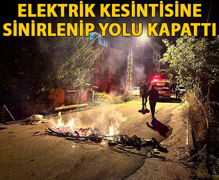 Elektrik kesintisine sinirlenip yolu kapattı